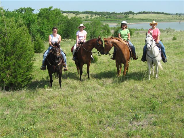 Riders pause by Lake Lavon